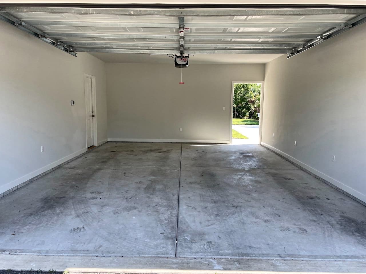 A garage cleared, swept, and left clean after a Brisk Junk Removal job