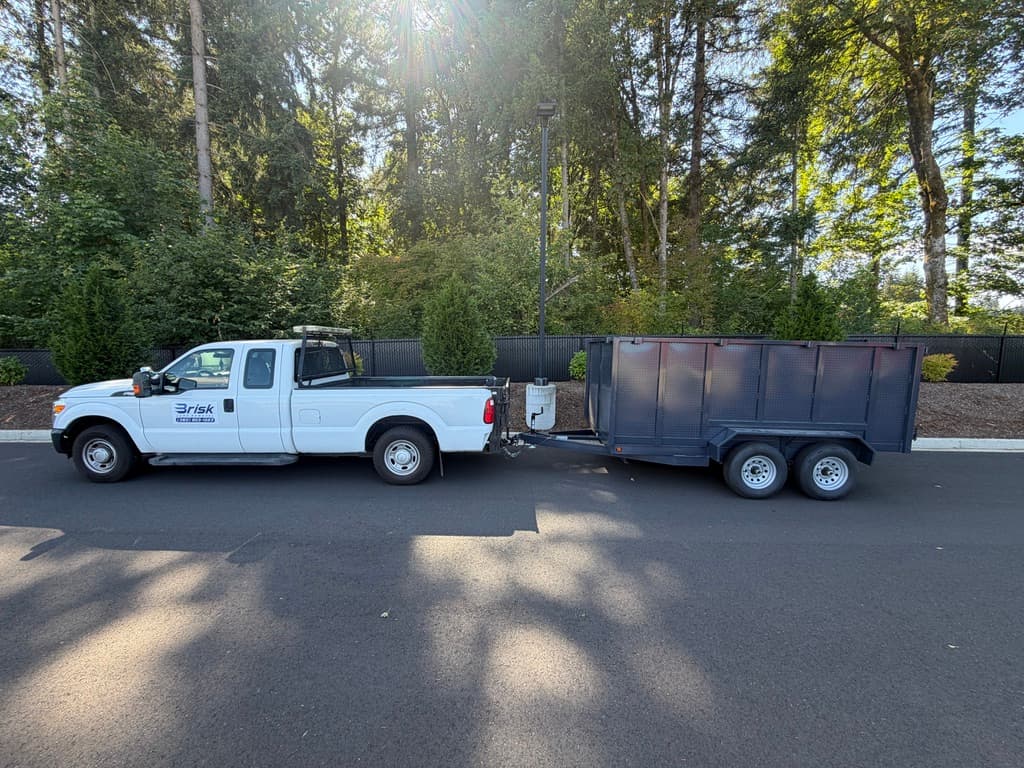 The first Brisk Junk Removal truck hitched to the company's first dump trailer
